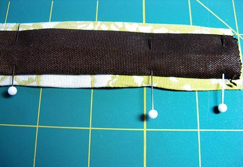 7. Pin in place the length of the strap. NOTE: It's worth taking a little extra time to double-check with your seam gauge as you pin to make sure the accent strip stays centered.