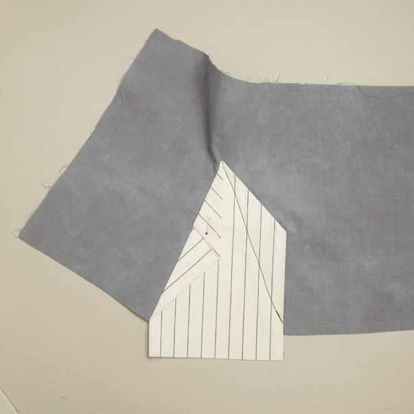 Choose the location along the hem then cut a slit into the shirt that is ½" (13mm) shorter than the center (godet) length.