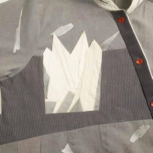 Cut the pocket out of fabric and finish the top edge by adding a strip of fusible facing. This adds structure and a facing at the same time.