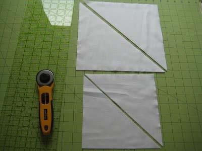 As shown below, cut each 7 5/8 square in half diagonally to form 2 half square triangles each. These will be the corners of your main quilt top.