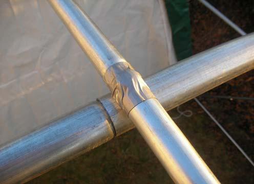 To elongate the life of Main Cover, put a small square of duct tape (field supplied) over each bolt head on frame that comes in contact with cover.