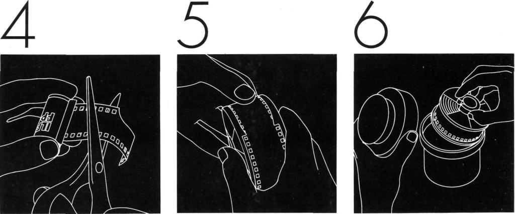 Pull all of the leader (the cutaway portion) beyond the lips of the cassette. Hold the cassette as shown in the diagram, so your finger-ends are out of the way of the scissors, and cut off the leader.