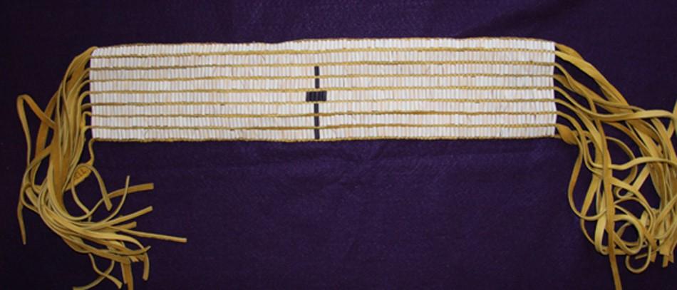 Seneca Cross Belt Length: 33.0 inches. Width: 3.5 inches. Beaded Length: 18.0 inches. Width: 4.0 inches. Total length with fringe: 38.0 inches. 115 columns by 8 rows.