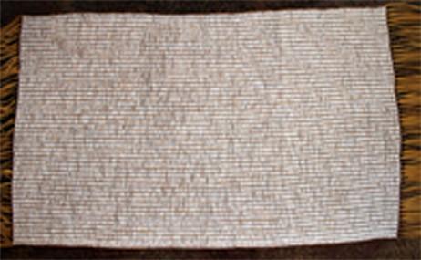 Great White Mat (White Thistle Belt) undetermined Beaded Length: 36.0 inches. Width: 28.0 inches. Total length with fringe: 60.0 inches. 205 columns by 50 rows. Total: 10,250 beads.