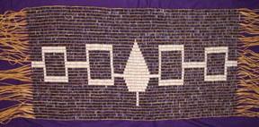 Hiawatha Belt Beaded Length: 21.5 inches. Width: 10.5 inches. Beaded Length: 31.25 inches. Width: 17.25 inches. Total length with fringe: 55.0 inches. 192 columns by 38 rows. Total: 7,296 beads.