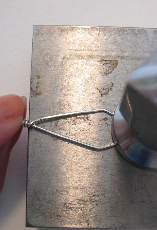 Use chainnose pliers to grasp and pull the wires into a top-heavy diamond shape [4].