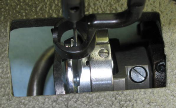 With the needle in the correct position (see step 8 above) move the assembly to the correct position and gently tighten one of the collar screws.