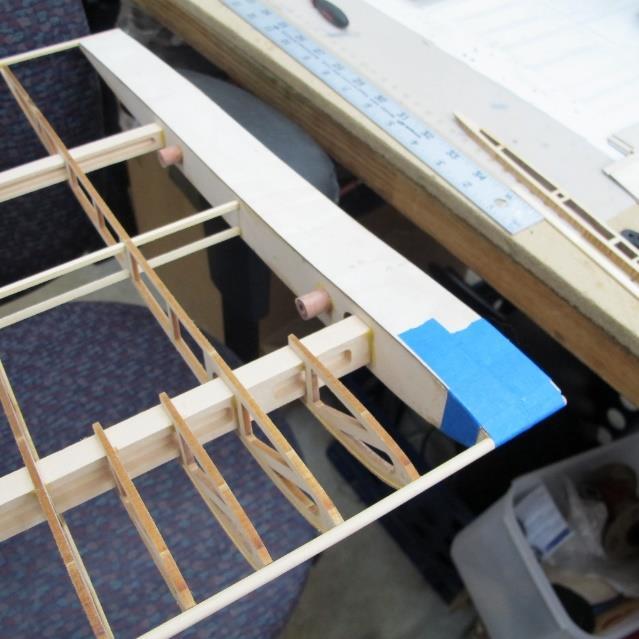 You can add the rib capping now. The goal is to keep the rib capping straight and evenly secured to each rib. It is suggested you start on the wing panel bottom side then do the top side.