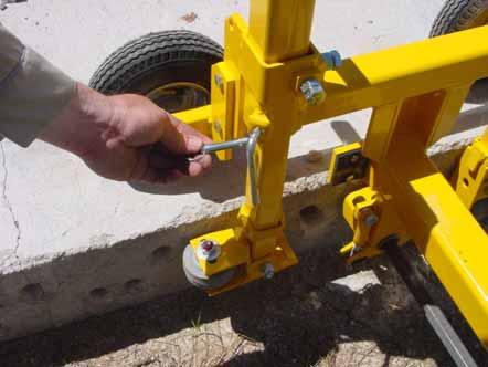 ADJUSTING FRONT LIFTING HANDLES If you need to drill close to a corner and the guide wheel is in the way, or if you are skew drilling, you can raise the guide wheel/front handle bar by
