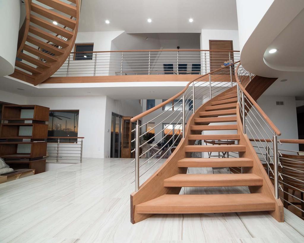 Aesthetic value: This expansive foyer is complimented with the grand and flowing feel of these two stairways and horizontal balustrade.