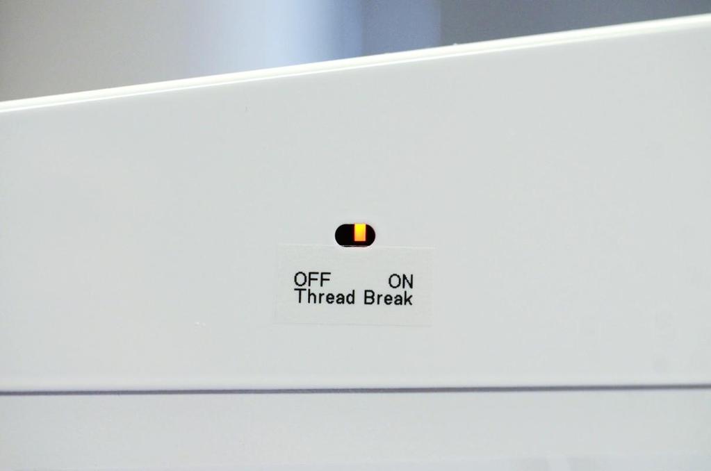 The thread sensor will reset when you stop the sewing motor to check for the thread break. (Using the Top Thread Break Sensor is optional, unless you wish to use the Low Bobbin Indicator.