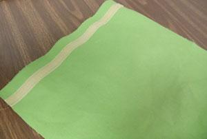 Add a strip of Velcro (the hook side) along the fabric from one mark to the next.