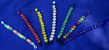 Bracelets Daisy-chain Bracelets Rainbow Daisy- chain White background CODE: ADULT DBA2 KID S DBK2