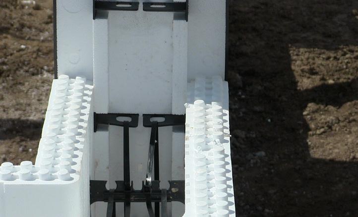 When the next course is laid use zip ties around the tie-back loop to connect the top piece of Pro Buck to the Logix block.