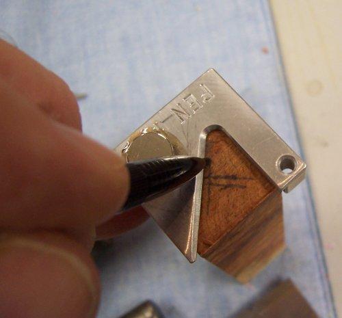 2. First, mark a center on each side of your blank. This little tool is called a "Pen Pal" from bestwoodtools.com.