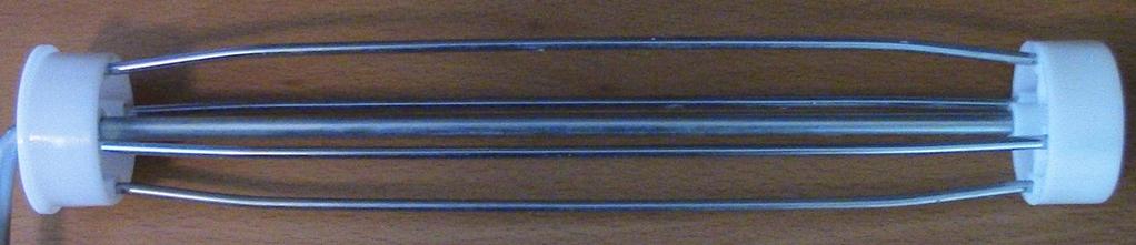 2 cm in diameter and 7 mm thick. The hole in the center is 0.6 cm in diameter. The washer is made of stainless steel (see Figure 10). 1.2 cm Figure 10 Washer 2.2.2.4 Framing Wires The four framing wires are steel rods that create a cylindrical cage which the disposable sleeve slides onto.