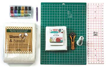 Supplies: Baby Lock Rachel sewing machine Baby Lock Coronet quilting machine 1 Charm pack of print fabrics (Lil Red by Moda) 1 Charm pack of solid white fabric (Bella Solids) 1 Yard of small red