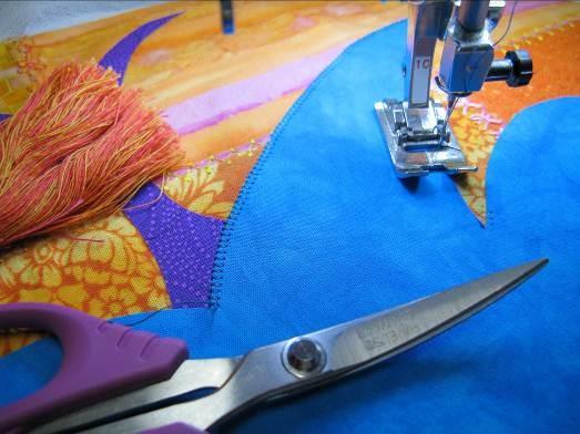 I also can determine where the fabric should be positioned under the needle so that the buttonhole stitch is right on the edge of the appliqué.
