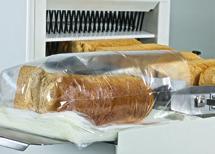After slicing of the bread, a bag blowing device automatically