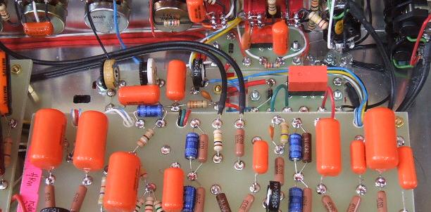 Internal view of HRM 100W illustrating post-overdrive tonestack. ORANGE arrow is MIDRANGE GREEN arrow is BASS BLUE arrow is TREBLE I ve read about something called a PI trimmer inside of the amp.