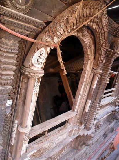 The window construction consists of wood and provides support for the ivory carvings which are fixed with iron nails to the support.