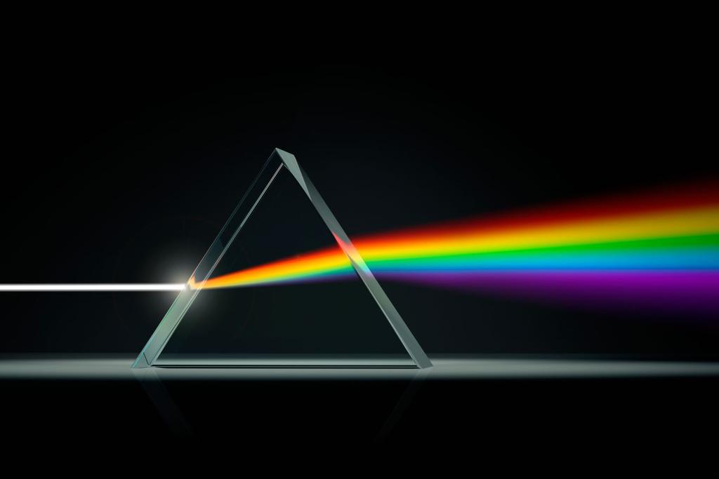 A prism is a triangular piece of cut and polished glass. When white light hits the prism, it simply spread the colors out by refracting each one at a different angle. The result is the spectrum.
