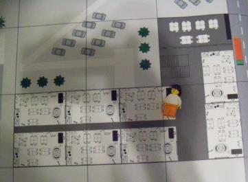 The Minifigure representing the scientist must be delivered by the robot to the four squares making up the Science Lab.