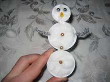 Hot glue beads on the snowman s face and body. 6.