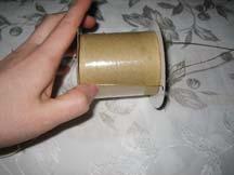 4. Wrap packing tape around the spool to hold