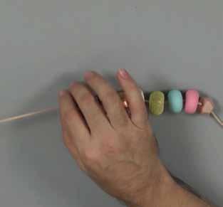 9 8. Placing the beads on a cord.