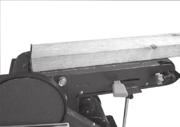 Depending on the work-piece, the belt sanding baffle can be removed for the vertical sanding operation.
