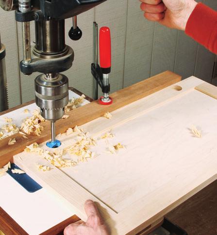 Remove any overhang on the top and sides of the face frame with a trim router, block plane or belt sander.