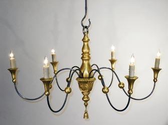 Finished off with a carved and gilded tassel, this chandelier is truly