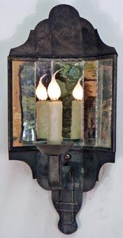 that old pewter look, and set in a wood frame with a brass candle