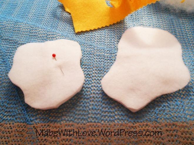 Fold the white felt in half and pin or trace your egg
