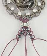 11) with the left and right cords around the center four filler cords. 3. Thread the center four filler cords though a 60 silver seed bead.