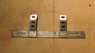 Clean up tag bracket with paint remover, then use steel wool,