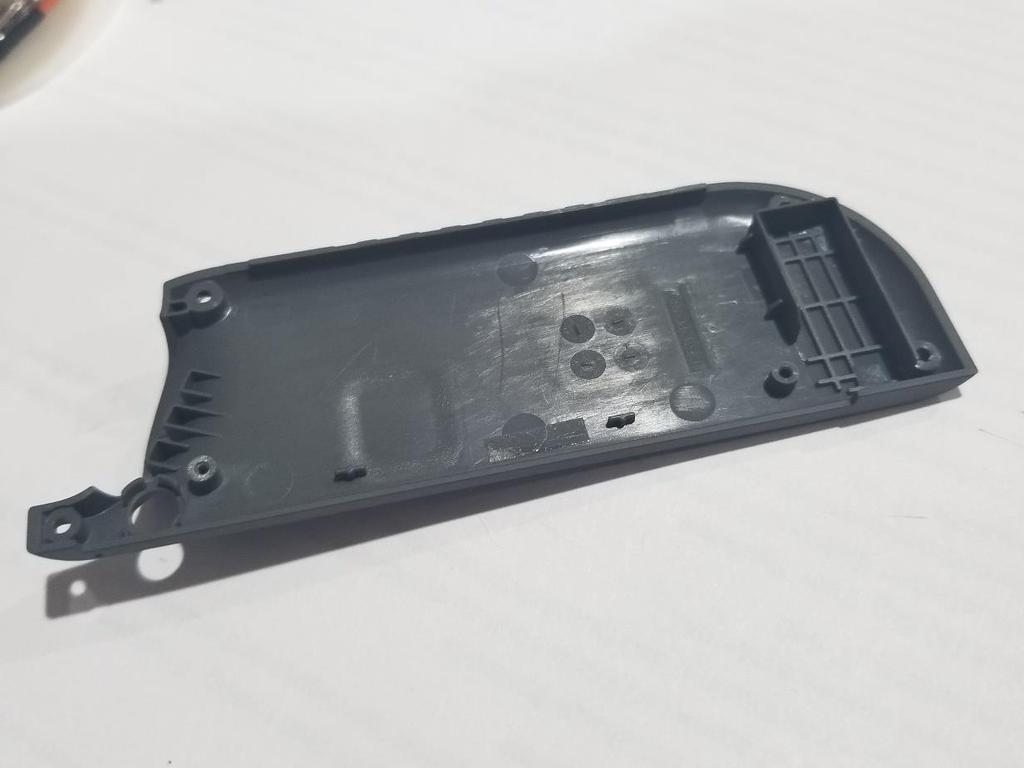 Prep the JoyCon Back 1. Remove the 4 YBit Screws from the back of the JoyCon. (You may have to press hard and turn slowly to initially break them free.