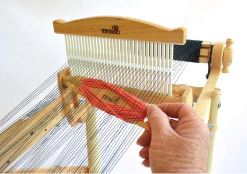 the neutral position, and turn the knobs on the front of the loom to tighten. You ll need a nice taunt warp to achieve a clean shed. It is very important that you do not make the warp too tight.