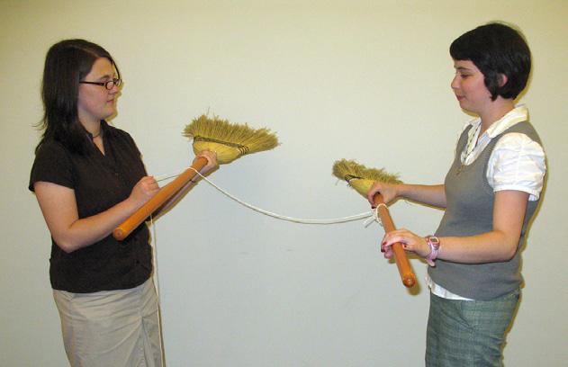 1) Have two students hold two brooms handles apart about 2-3 feet from each other.