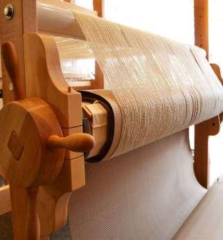 Major Parts of Loom: Warp Roller: The warp roller which consists of the lengthwise yarns is located at the back of the loom & it releases the warp yarn to