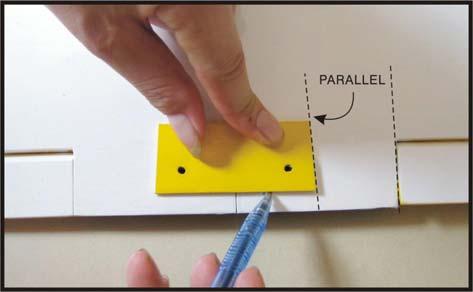 With the wing bolt plate centered over the holes, use a sharpie pen to trace around the plate onto the wing.