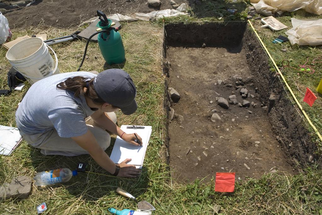Cornell University graduate student Beth Ryan exposes a preserved Seneca