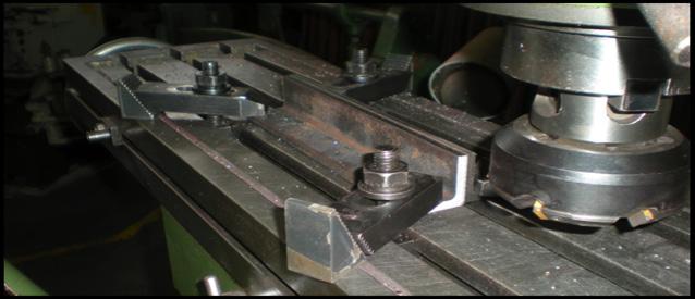 4. Clamp rails to mill bed using a clamp kit.