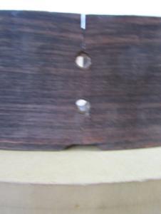 My frame with a peep hole cut to the depth of the head block. Such a hole is cut into both head and tail blocks.