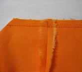 Stitch each side seam from the raw edges to the cutout rectangles, leaving the spaces between the