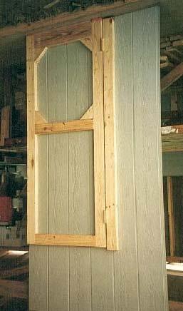Once the siding is erected on the site, you simply take a handsaw and finish cutting these three 4-inch sections and the door will swing perfectly.