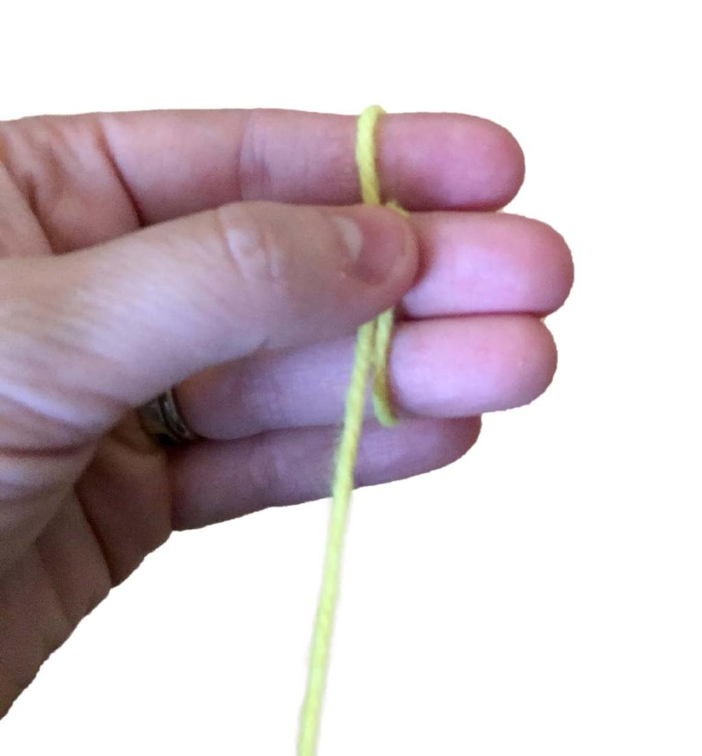 Instructions: 1. Start by cutting an 8-10 inch piece of yarn and a 15 inch piece of yarn and set it aside. You will need them in later steps. 2.