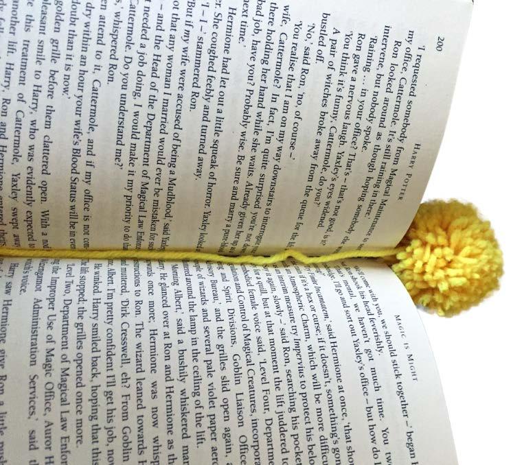 To add the tail of the bookmark, use the 15 inch piece of yarn and
