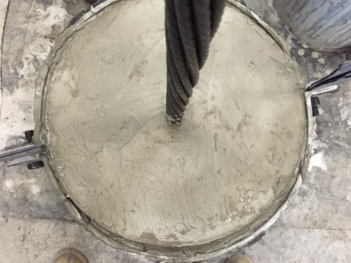 layer of foam was inserted between faceplates to prevent mortar leakage. After 24 hours of curing, each of the four bolts were tightened with a micrometre torque wrench to 40 N m.